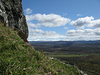 Looking from the Creag Dhubh crags towards the snow-covered plateau of the Cairngorms